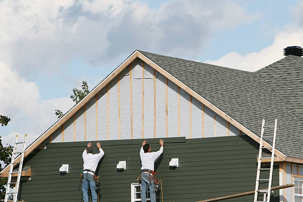 Professional Storm Damage Siding Repair technician working in Rural Hall, NC